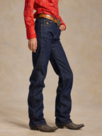 Dark denim jeans on model, straight leg with five-pocket design and contrast stitching