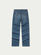 Medium-wash denim jeans back view with yoke and two rear button-flap pockets.