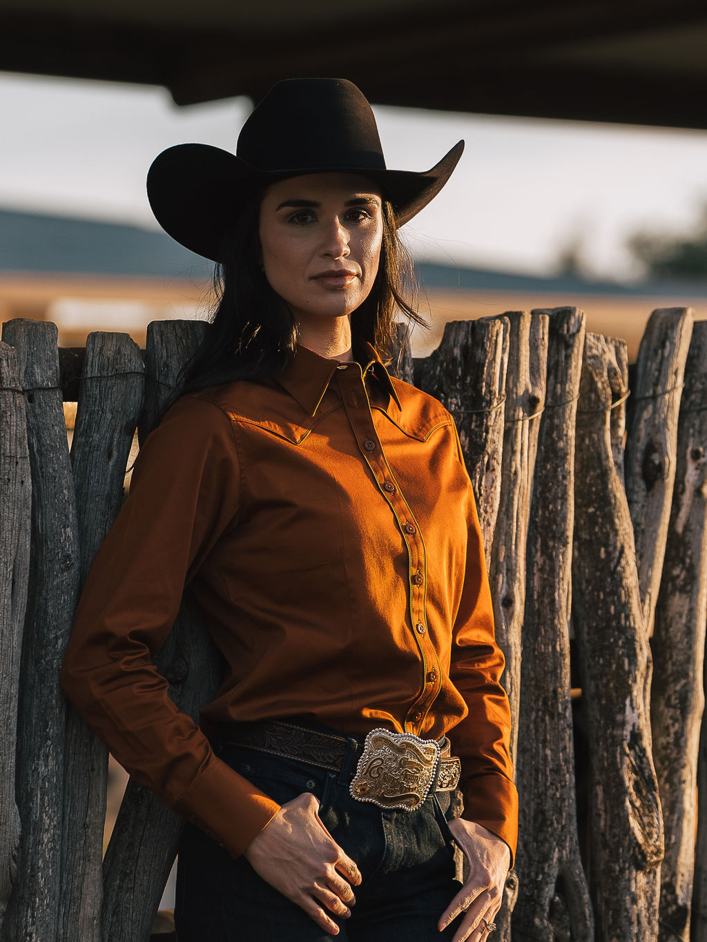 Women’s button-up shirt in dark caramel, long sleeves and collared front