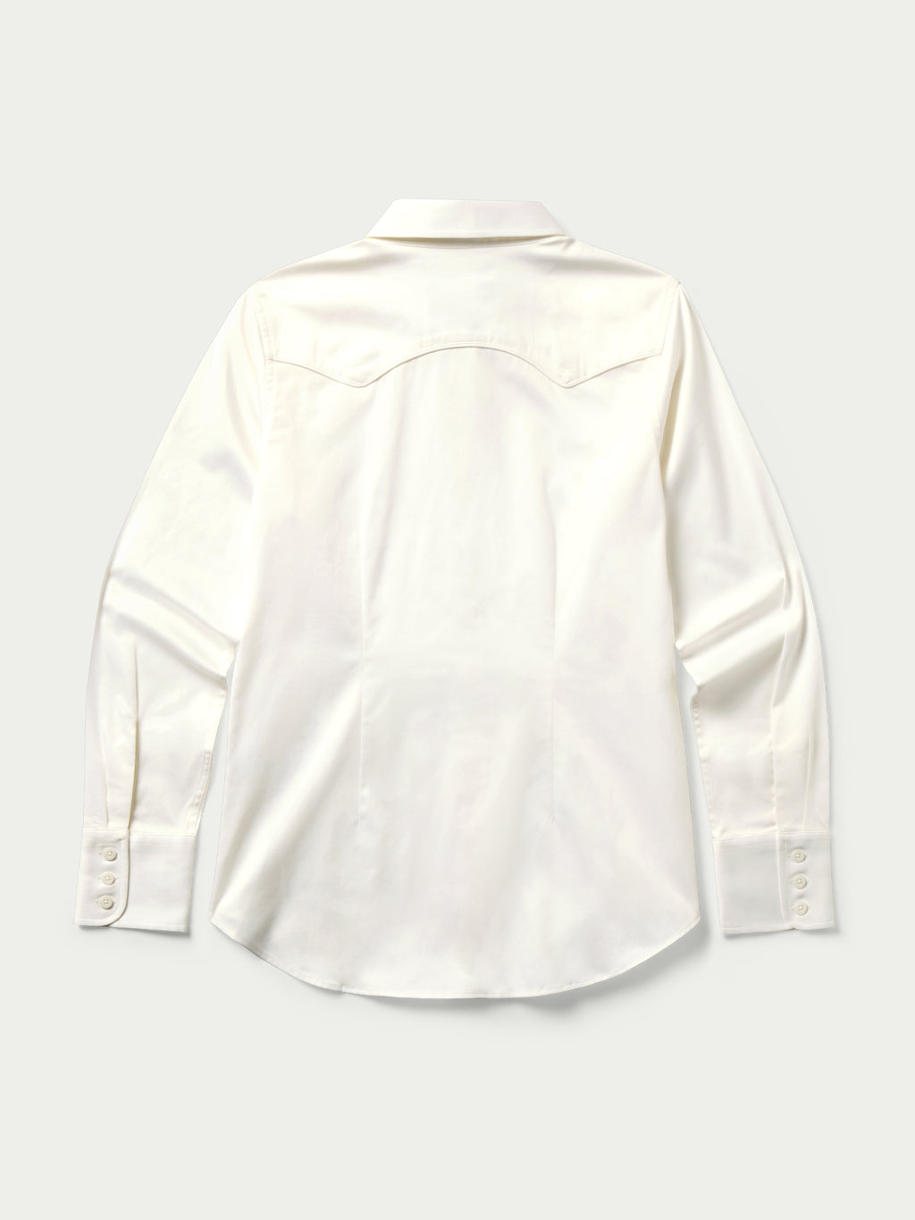 Women’s white button-up shirt with long sleeves, pointed collar, and button front