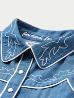 Chambray shirt collar with white embroidery and button placket detail