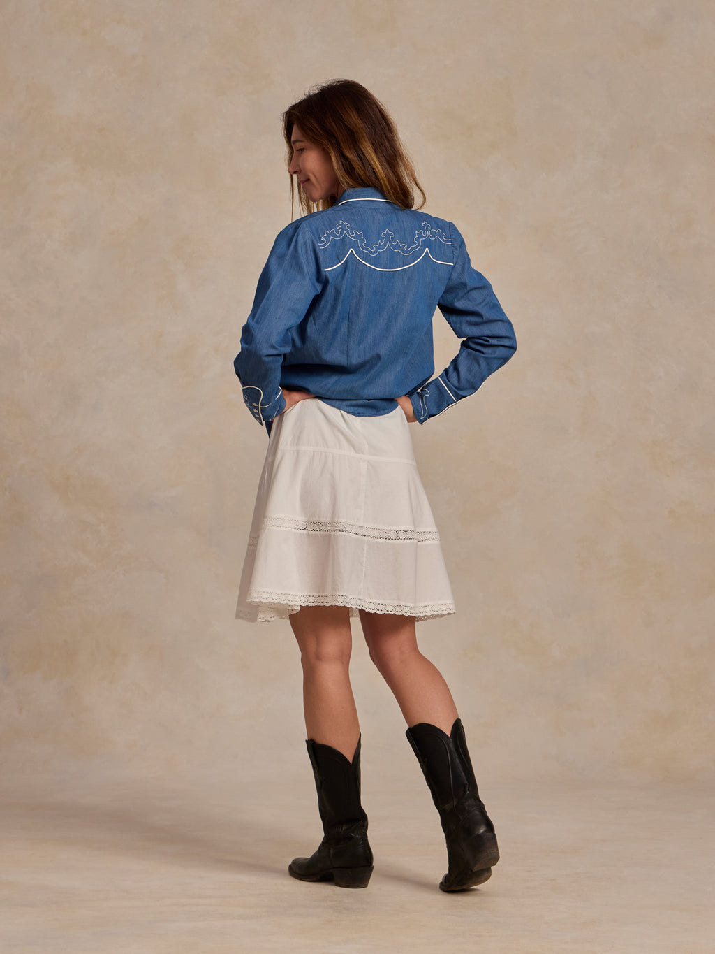 Embroidered chambray denim button-up shirt, back view with yoke and seam stitching