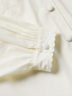 Vintage white blouse sleeve with ruffled cuff and covered button detail