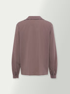 Back view of washed plum button blouse with long sleeves and gathered cuffs
