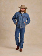 Medium indigo fleece-lined denim jacket with western snap chest pockets and button front