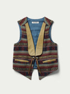 Women's patterned wool vest with V-neck, tan trim, tie belt at waist, button closure
