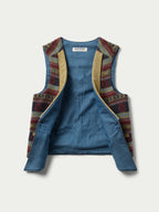 Women's patterned wool vest with V-neck and tan trim, multicolor tribal pattern lining