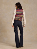 Wool vest with multicolor blanket stripe pattern, tan back yoke, snap-and-lace trim