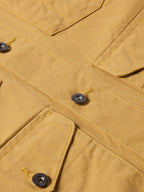 Suntan brush jacket chest detail with flap pockets and snap buttons