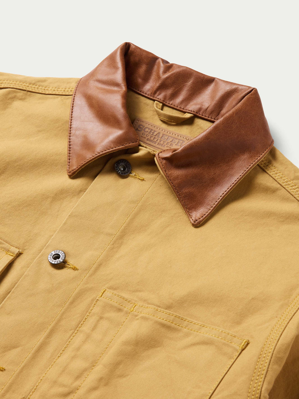 Suntan brush jacket with brown cord collar and snap placket