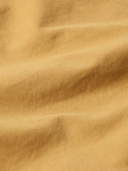 Suntan brush jacket fabric close-up showing smooth weave texture
