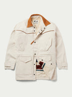 Natural drifter coat front view with tan collar, snap front, and multicolor chest graphic.