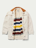 Durango Drifter coat in natural canvas with brown hood lining and multicolor striped yoke
