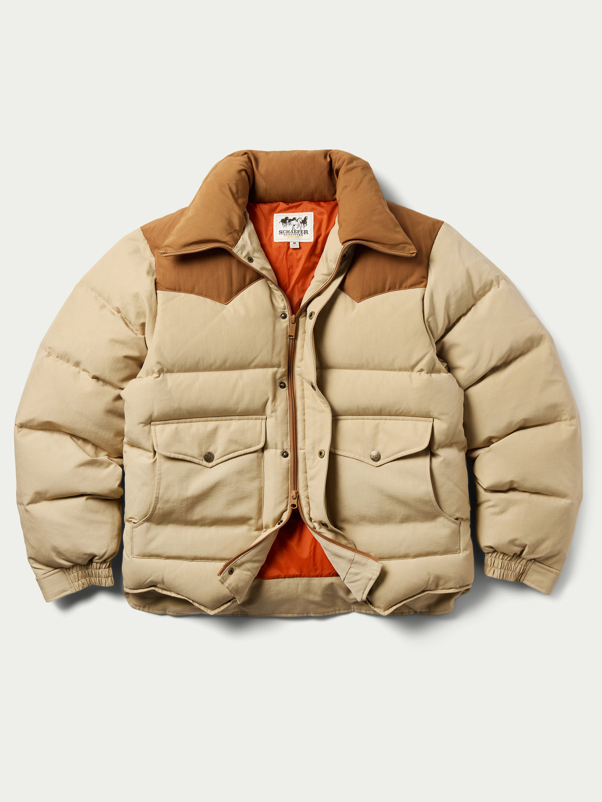 Tan and cream color-block down jacket with snap front and two chest flap pockets