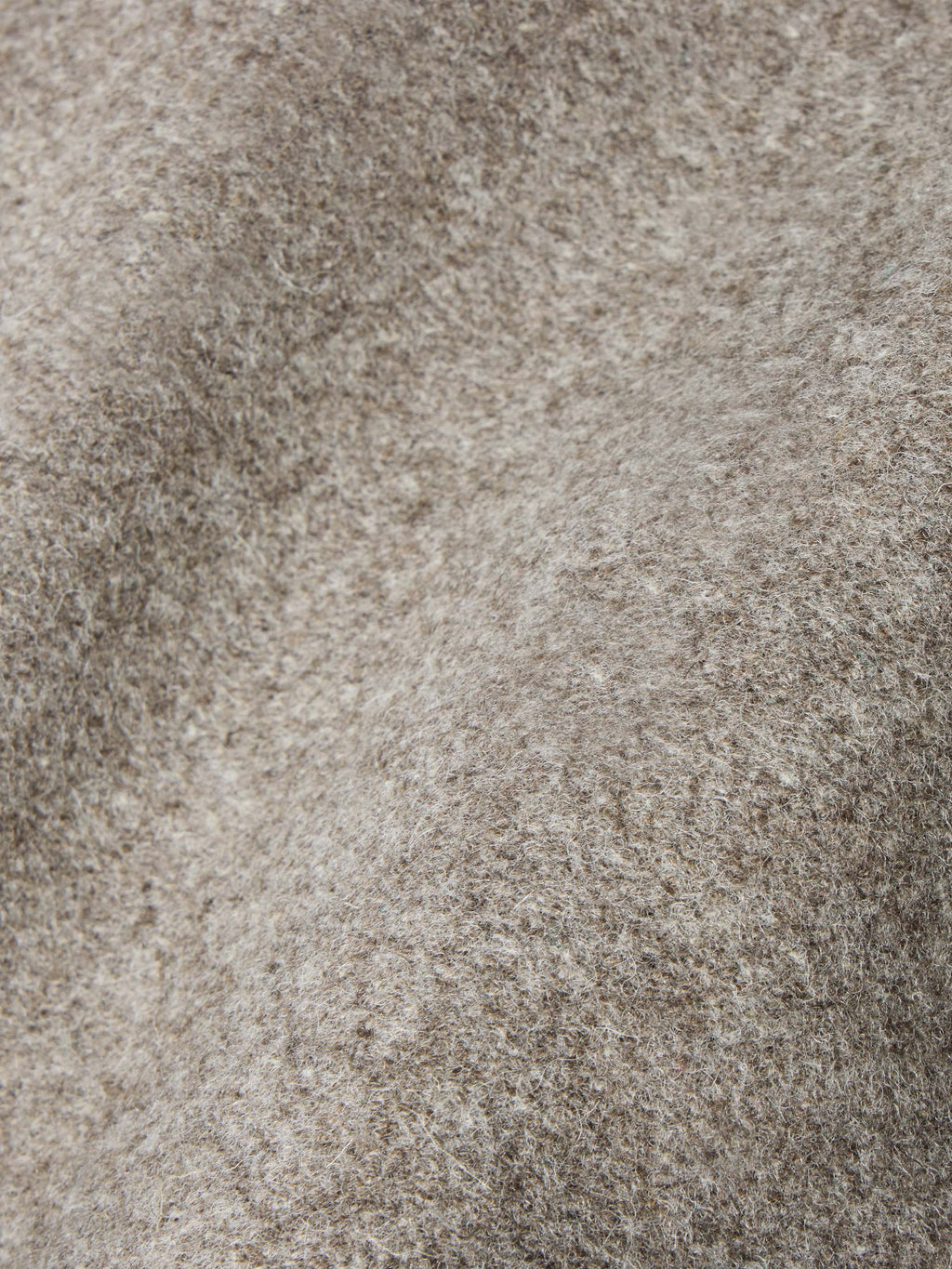 Taupe wool vest fabric texture close-up with fine heathered weave