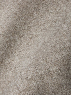 Taupe wool vest fabric texture close-up with fine heathered weave