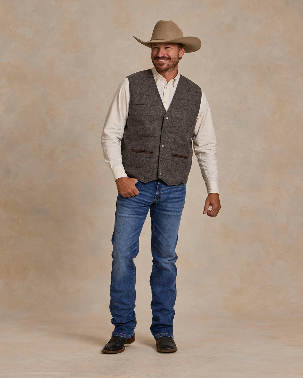 McAllin wool vest in heather gray windowpane plaid with two chest pockets and buttons