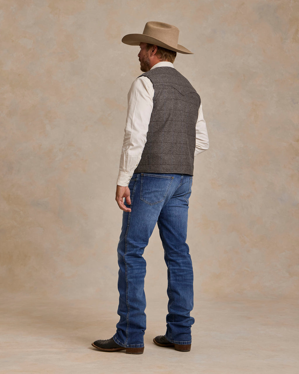 McAllin wool vest back view in heather gray windowpane plaid, sleeveless cut