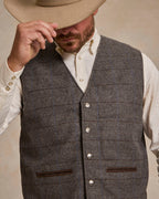 Men's heather gray windowpane wool vest with V-neck, silver buttons, and welt pockets