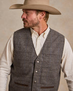 Heather gray windowpane wool vest with V-neck, button closure, and flap pockets