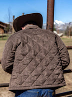 Brown quilted microsuede jacket with diamond stitching, zip front, and side pockets