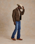 Brown quilted microsuede jacket with stand collar, button pockets, and zip front