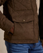 Brown quilted microsuede jacket lower detail: snap flap pockets and seam quilting