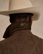 Brown quilted microsuede jacket with diamond stitching and ribbed knit collar