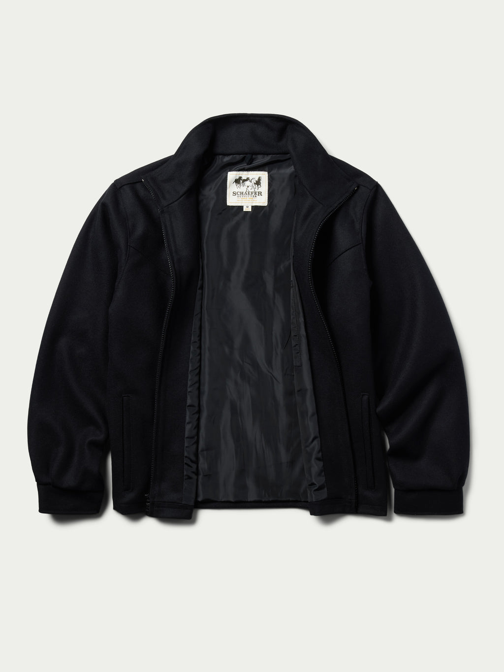 Black wool arena jacket open to show interior lining and zipper placket