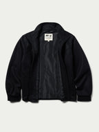 Black wool arena jacket open to show interior lining and zipper placket