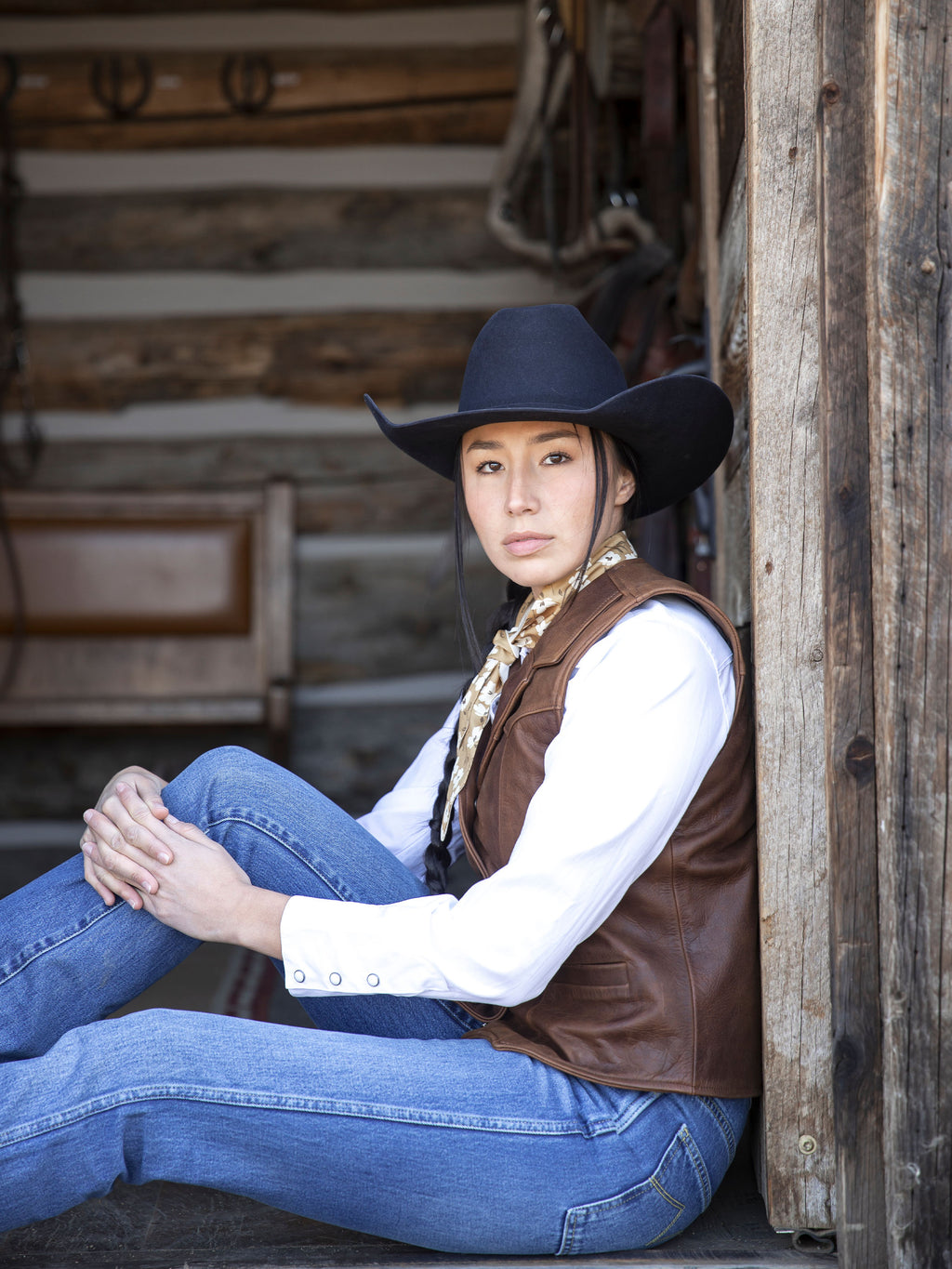 Women's whiskey-brown leather vest with layered collar and front button placket