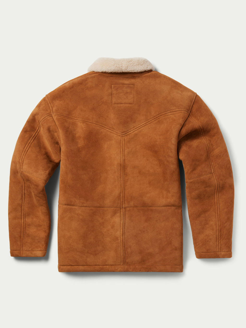 Buckskin shearling coat with cream shearling collar, button front, and side pockets