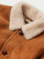 Shearling-lined collar and buttoned front on a buckskin suede coat