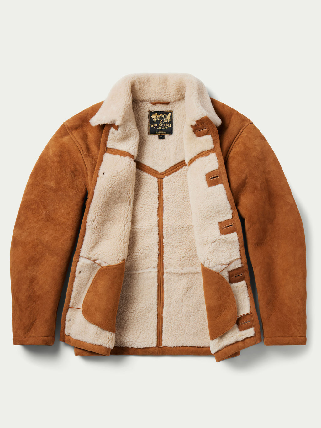 Buckskin suede jacket with cream shearling lining and decorative patch-style panels