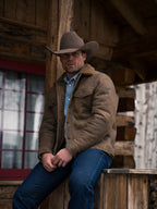 Men's brown trucker jacket with sherpa collar and button-front, sitting side view