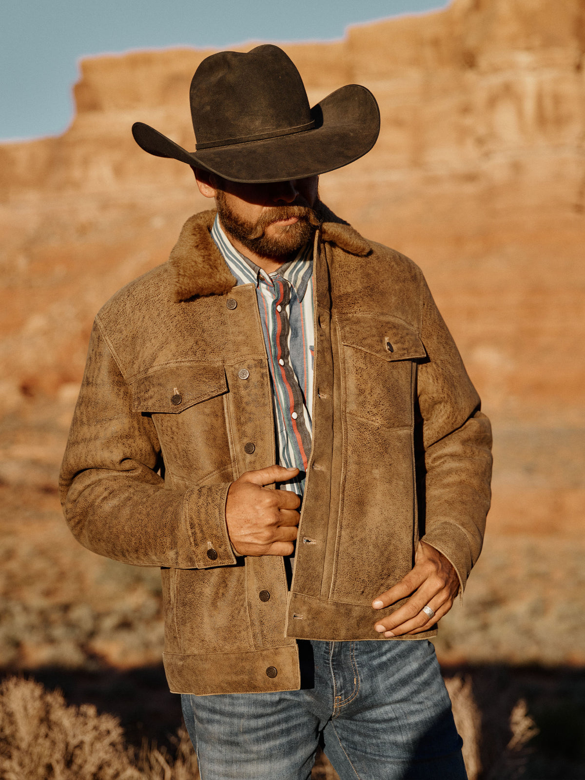 Vintage brown suede trucker jacket with snap buttons and two chest pockets