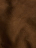 Brown roughout suede fabric texture close-up