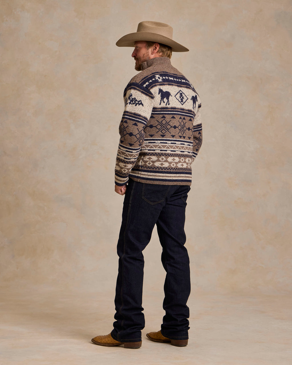 Full zip knit sweater, cream with navy and tan western pattern, back view
