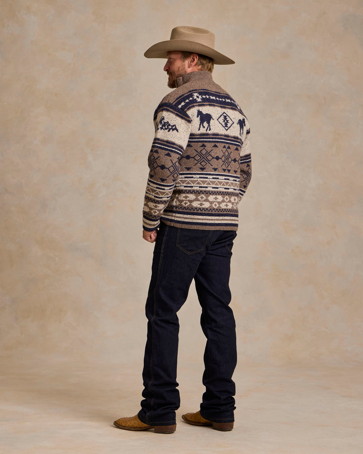 Full zip knit sweater, cream with navy and tan western pattern, back view
