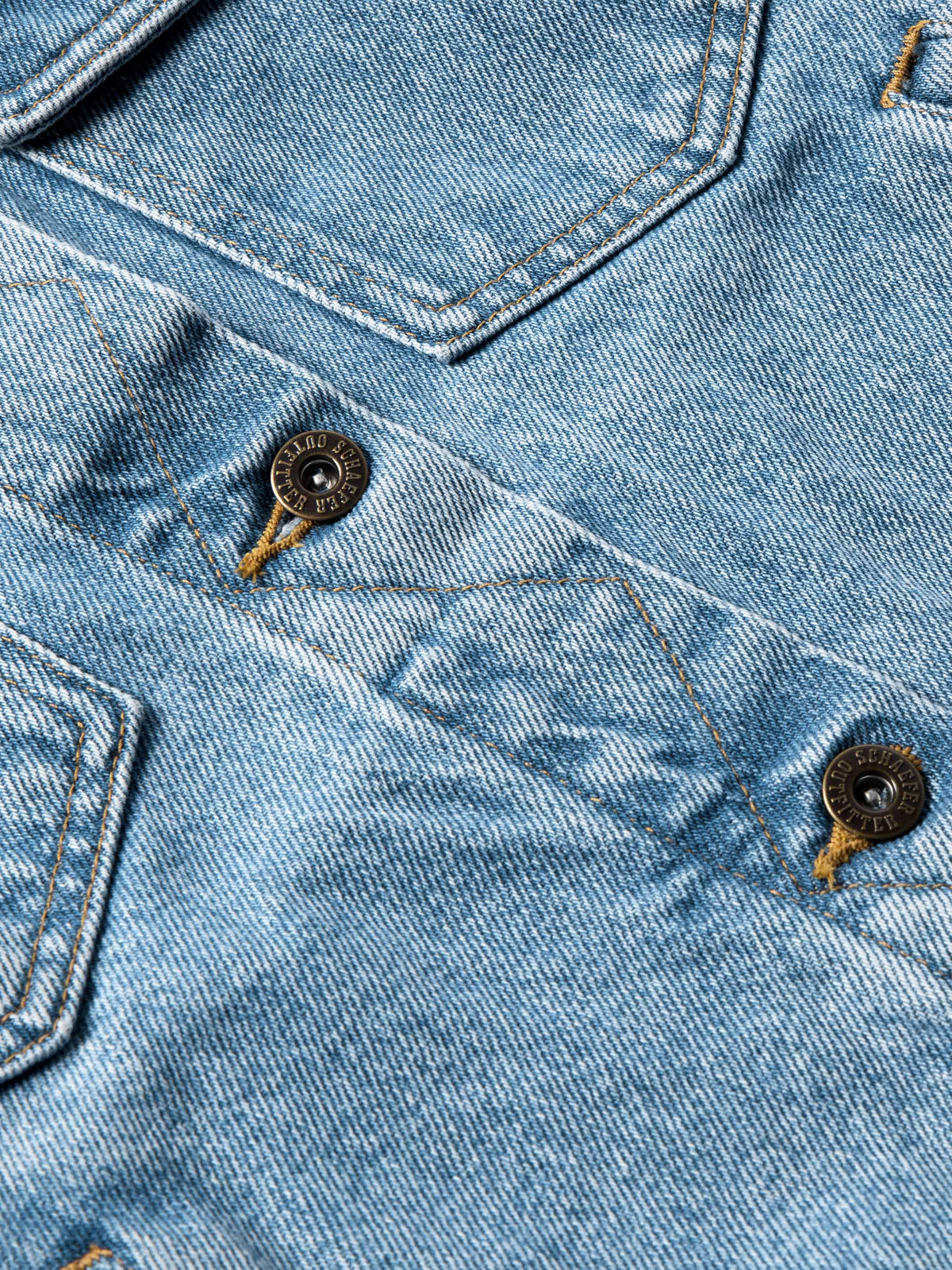 Light wash denim jacket close-up with decorative stitching and dark buttons
