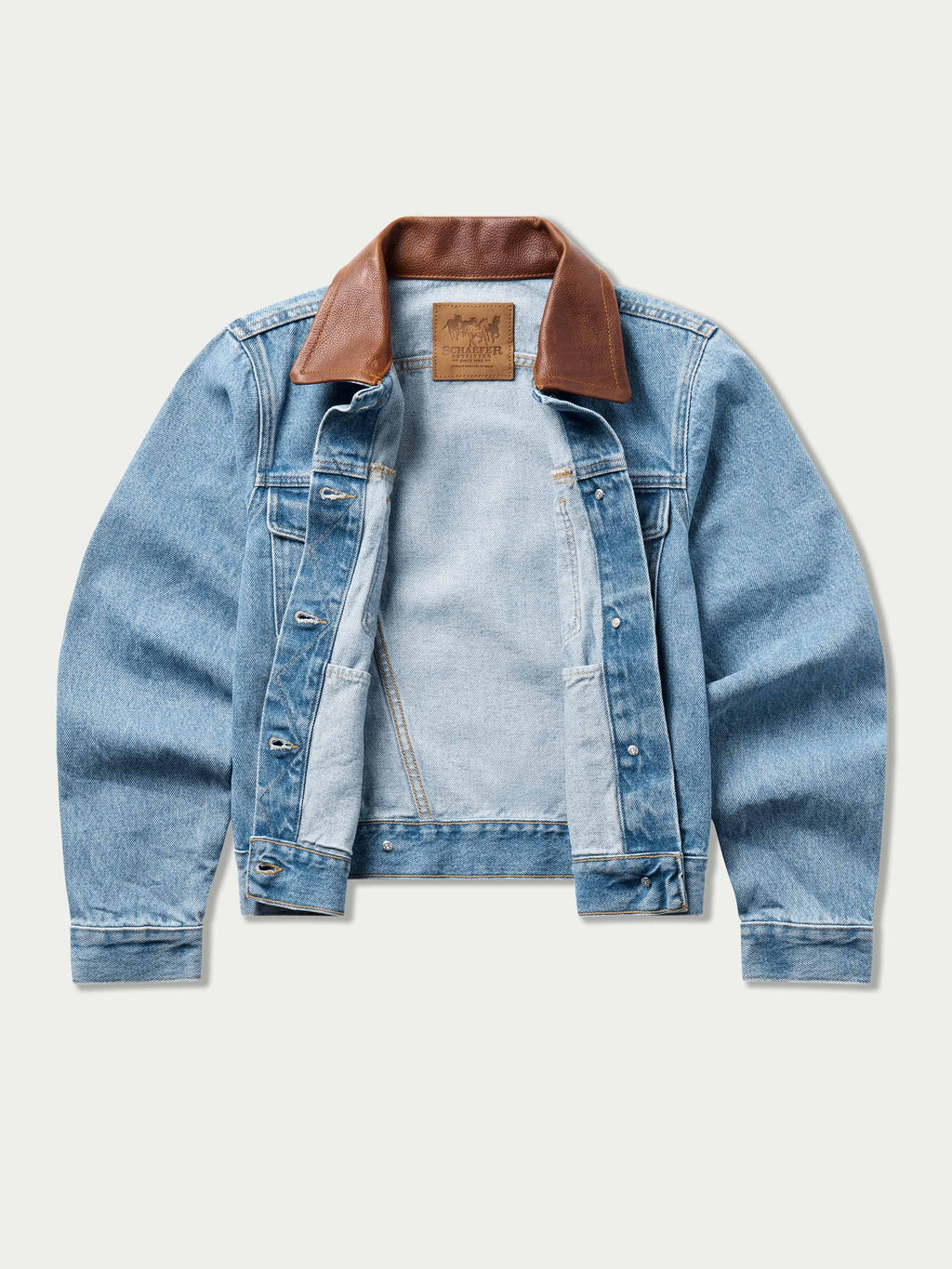 Light wash denim jacket with brown collar, button placket, and snap pockets