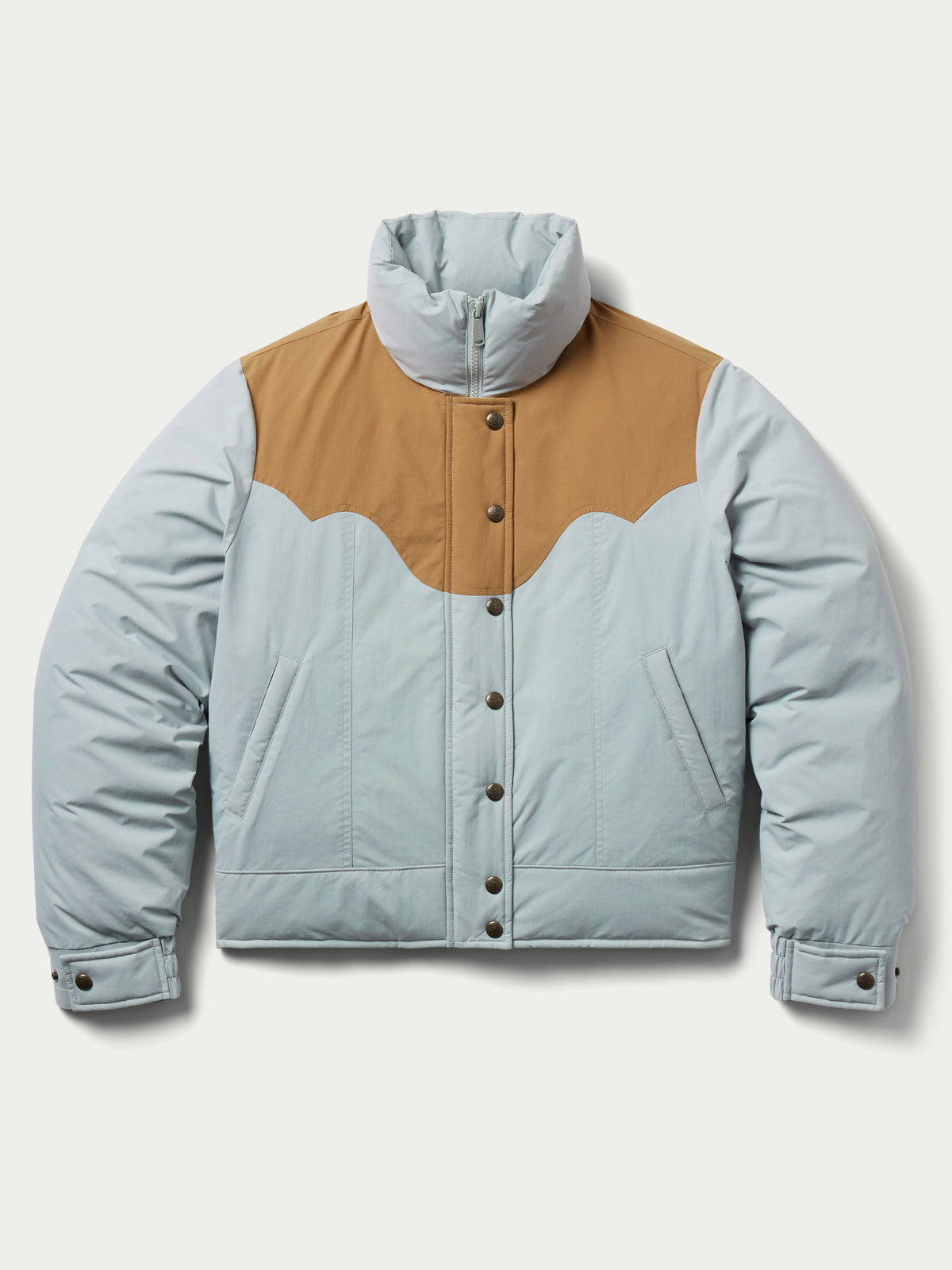 Women’s down jacket front, light blue shell with tan yoke and snap-through button closure