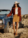 Women's Toscana jacket in auburn faux fur over white top and tan skirt