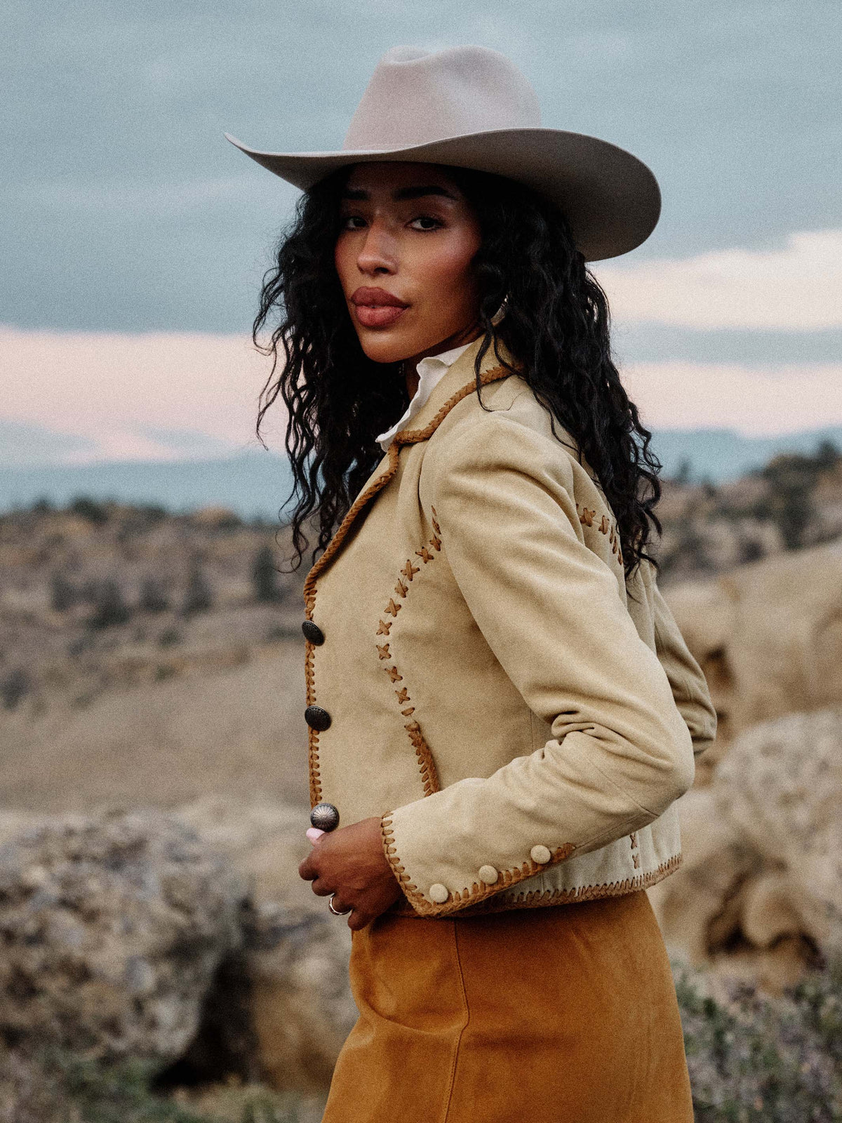 Buttercream suede whipstitch jacket with button-front placket and round neckline