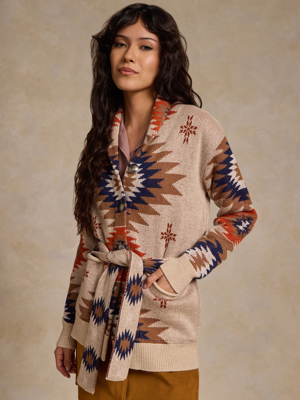 Belted knit sweater with geometric pattern and tied waist, long sleeves