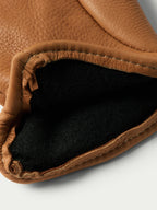 Saddle deerskin insulated glove cuff with dark fleece lining detail