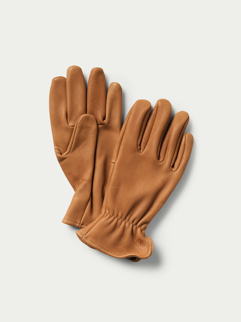 Deerskin gloves in saddle tan, full-finger design with stitched cuff