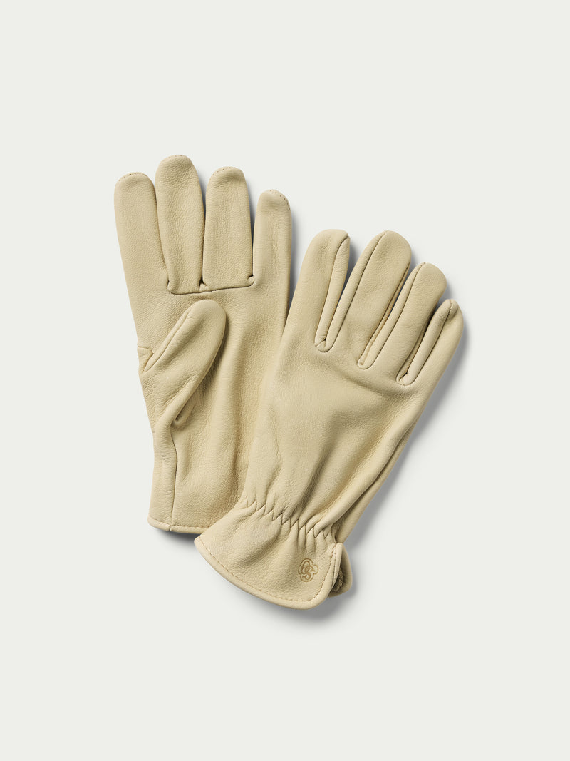 Natural goatskin gloves with five fingers, stitched seams, and wrist cuff