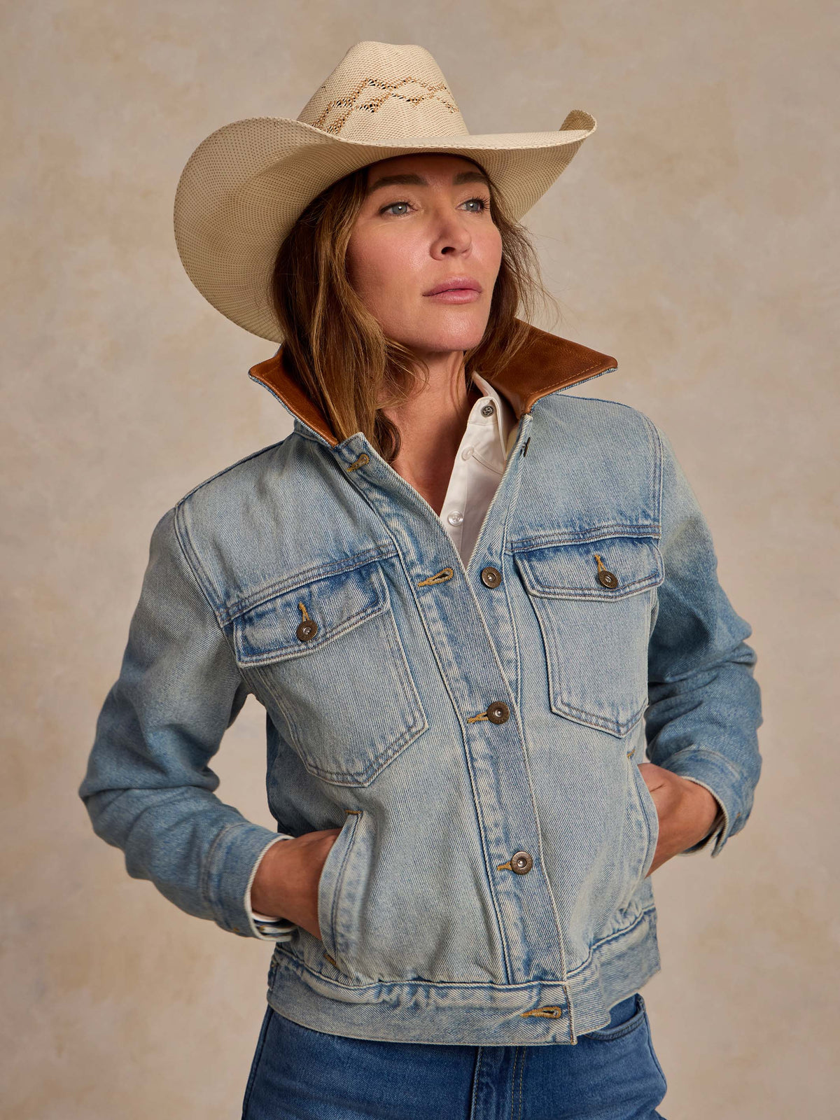 Vintage-wash denim jacket with brown flannel lining and buttoned chest pockets