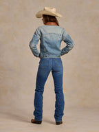 Back view of light blue denim jacket with brown flannel collar and snap details
